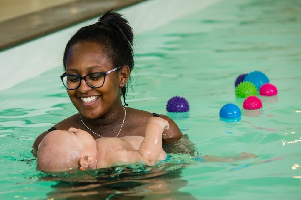 mother-holding-their-baby-in-a-swimming-pool